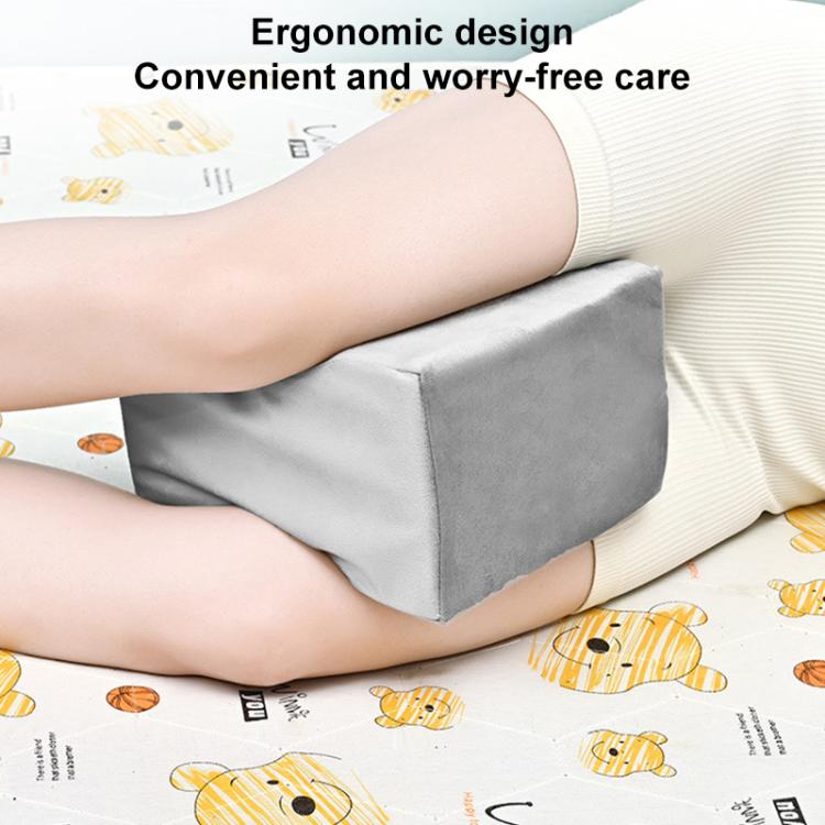 Gray wedge knee support pad pillow with smooth fabric cover and stitched edges