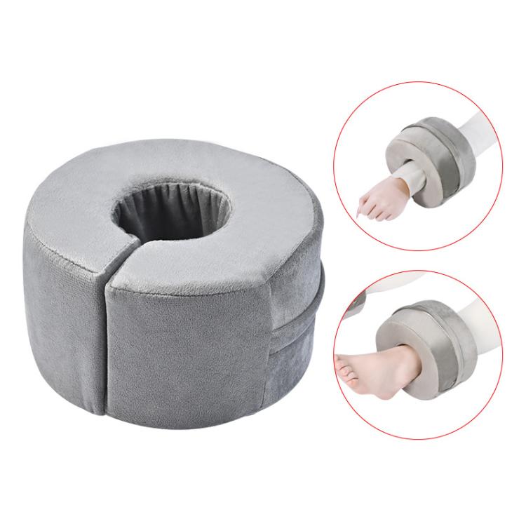 Gray round ankle support cushion with center opening and stitched edges