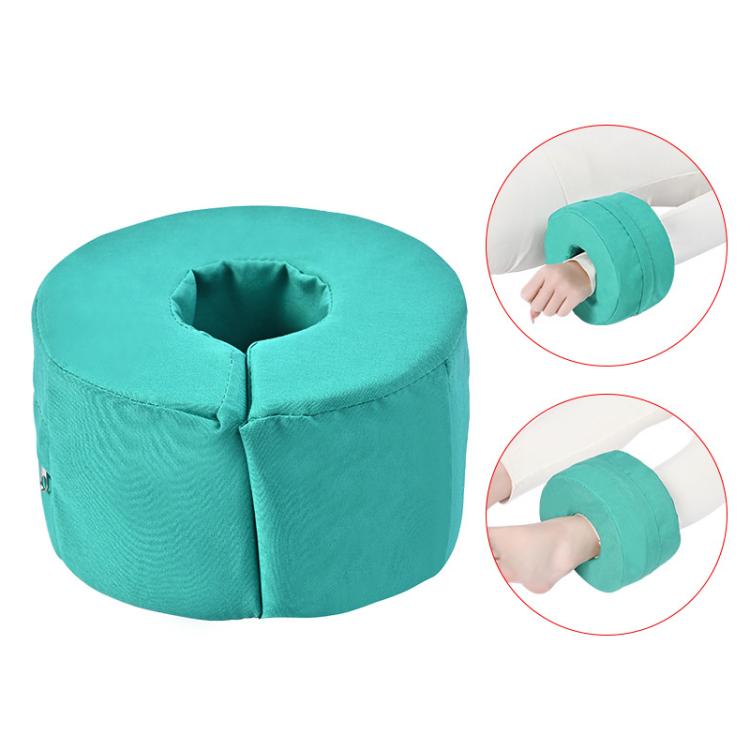 Teal round ankle support cushion with center opening and quilted seams