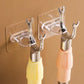 Clear adhesive hooks with curved holders on wall for bottles or accessories