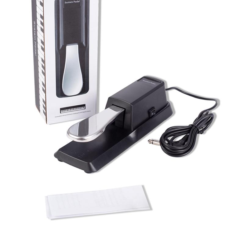 Black sustain pedal with 6.35mm plug and coiled cable, plus box and leaflet