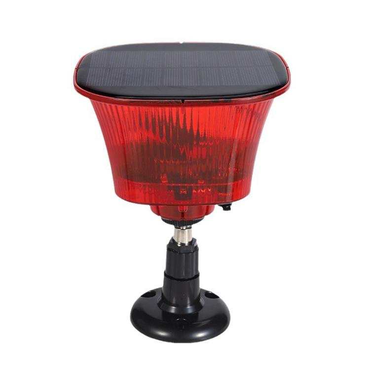 Red translucent solar animal repellent light with black pedestal stand