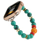 Beaded Apple Watch band with turquoise beads, red and orange accents, and gold spacers