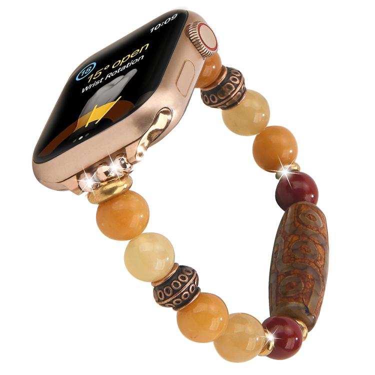 Beaded Apple Watch band with amber and cream beads and a carved brown focal bead
