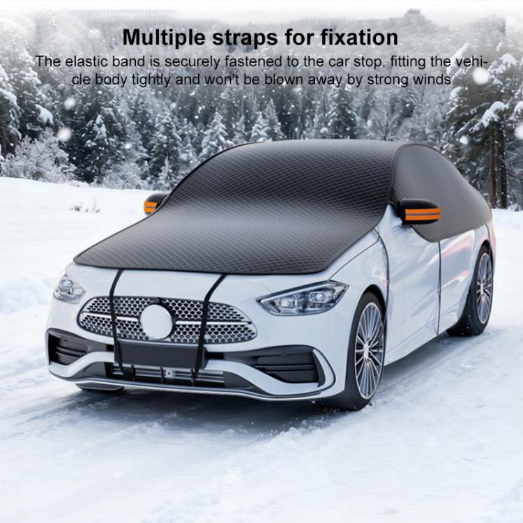 Sedan with dark car cover over hood and mirrors; multiple fixation straps visible