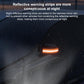 Close-up of dark car cover edge with orange reflective strip and window-side seam