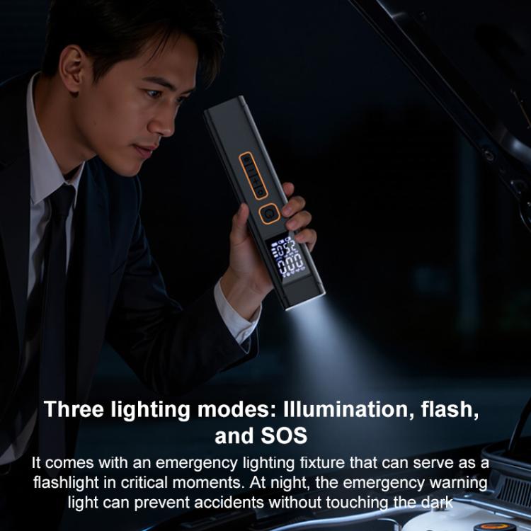 Dual-screen car air pump held in hand with illuminated digital pressure display