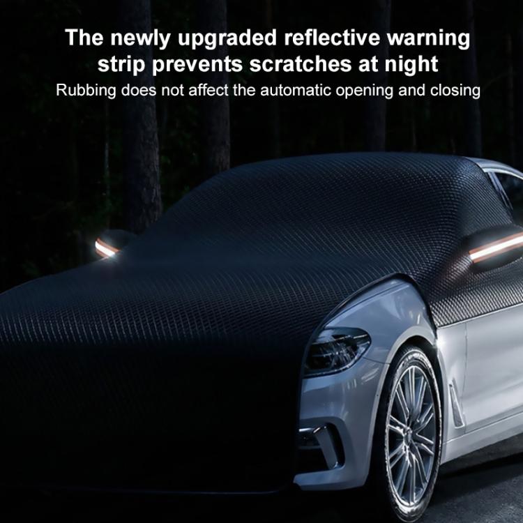 Dark car half cover with a reflective warning strip along the edge near the headlight.