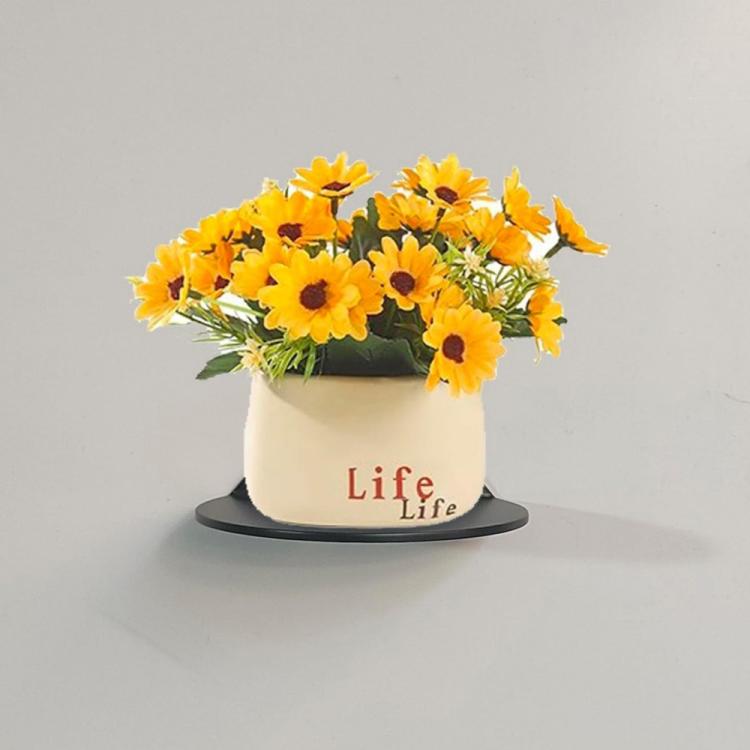 Black wall-mounted storage rack holding a pot with yellow flowers