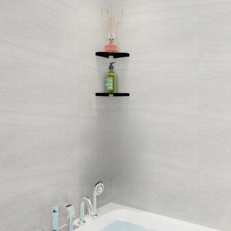 Wall-mounted triangular black corner shelf holding toiletries and a bottle