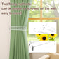 Clear acrylic curtain tieback holder clip securing green drapery
