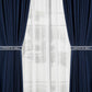 Clear acrylic curtain tieback holder clips holding navy drapes