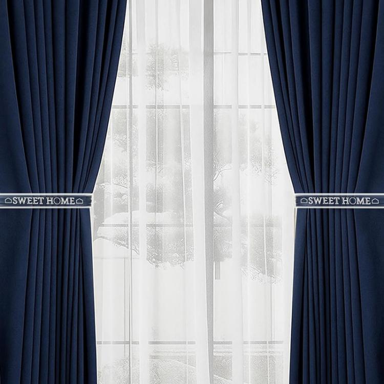 Clear acrylic curtain tieback holder clips holding navy drapes
