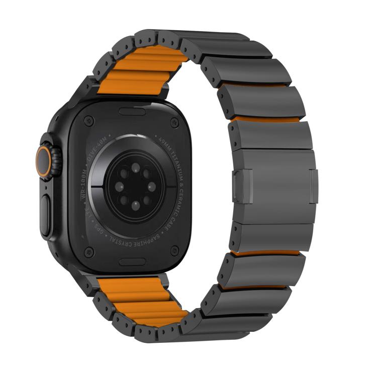 Back view of a dark gray Apple Watch band with orange inner links and magnetic clasp.