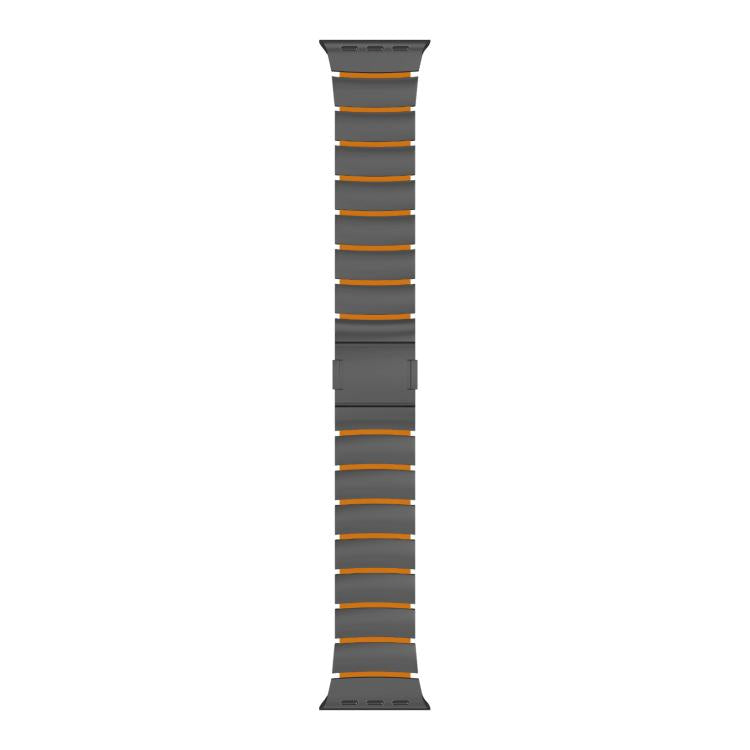 Dark gray linked Apple Watch band with thin orange accent stripes.