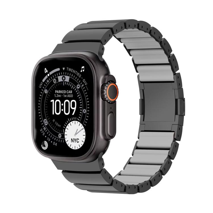 Dark gray linked Apple Watch band shown attached to a watch.