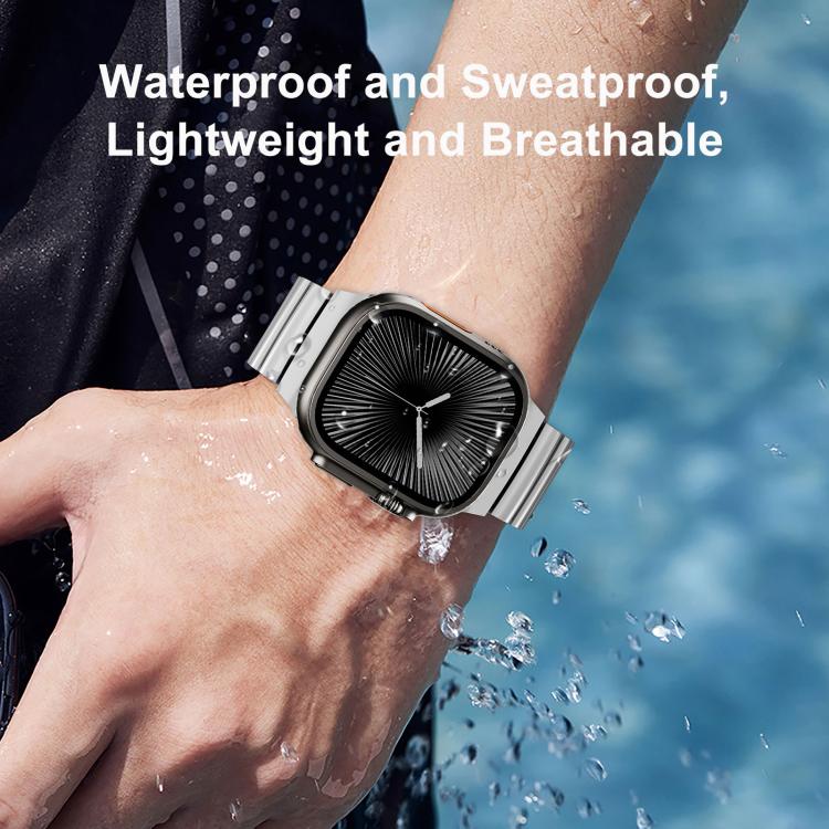 Apple Watch band with silver titanium links and a dark magnetic clasp, shown on a wrist.