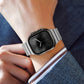 Silver titanium Apple Watch band with a magnetic clasp, worn with a dark watch face.