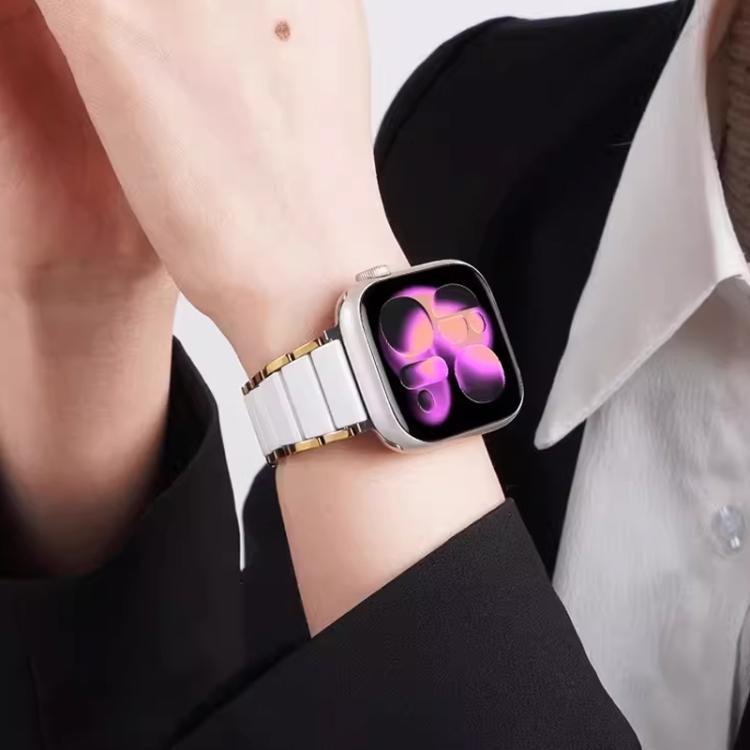 xDfind two-tone watch band with white links and gold accents, worn on a wrist