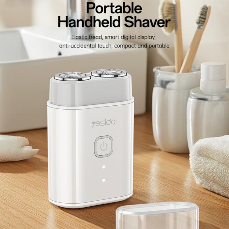 Portable handheld electric shaver with two shaving heads and front power button, white