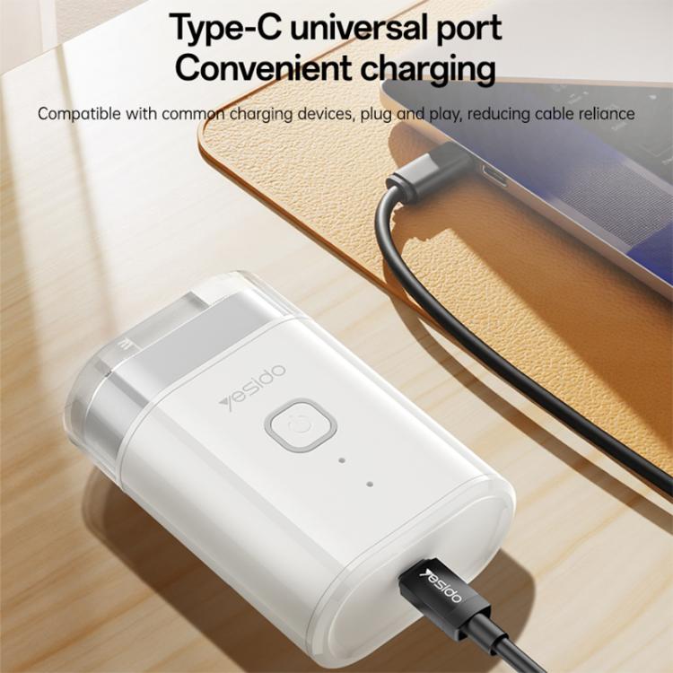 Portable electric shaver with USB-C charging port connected to a cable, white body