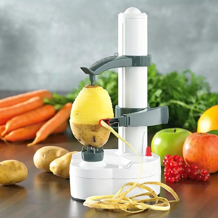 White electric peeler with upright fruit holder and potato spiral peels