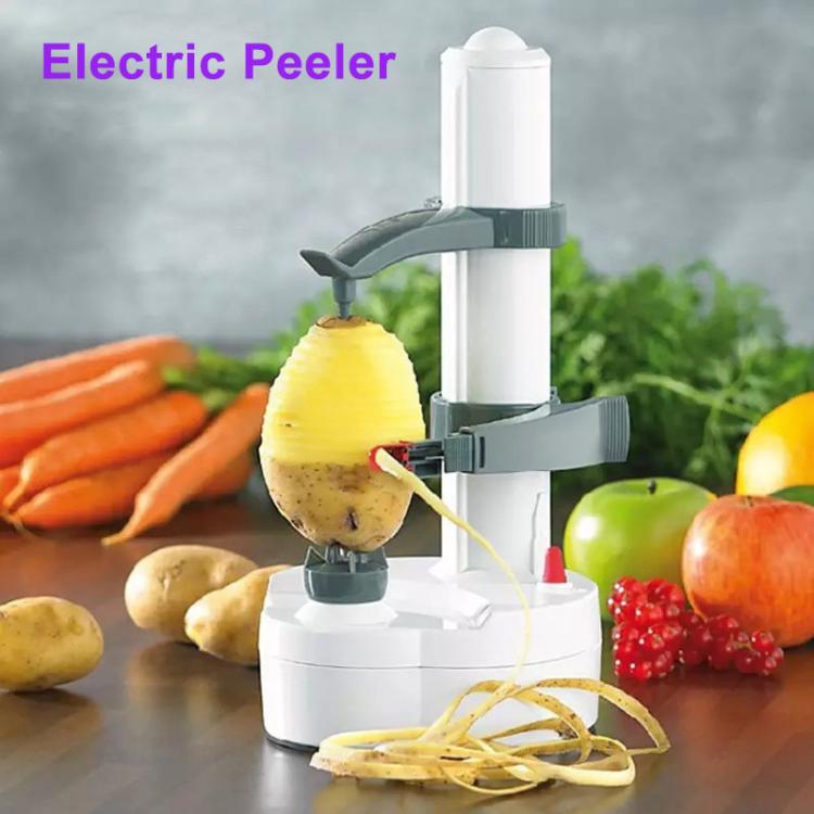 White electric vegetable peeler producing spiral peel ribbons from potato