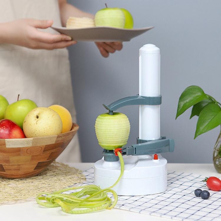 White electric peeler with onion mounted and spiral vegetable peel on base