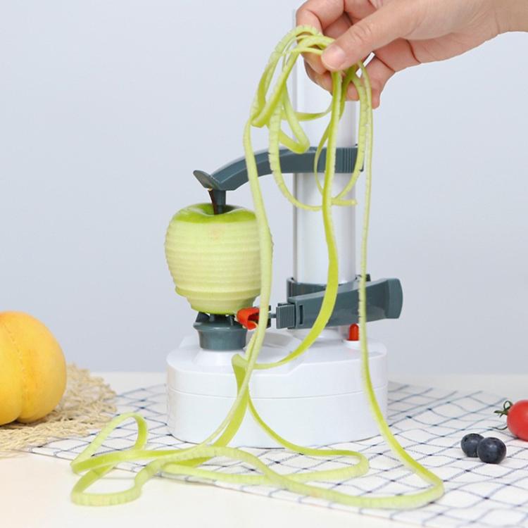 Electric vegetable peeler with long spiral peels held above base