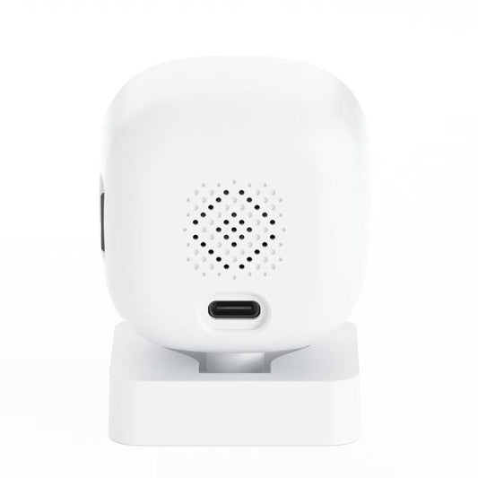 White indoor dome surveillance camera on stand with front speaker grille