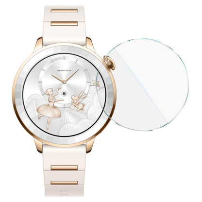 Round tempered glass watch screen protector beside a gold-tone smartwatch