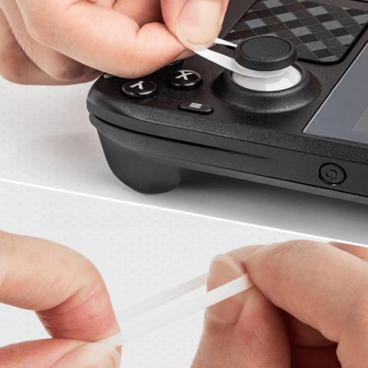 Hand applying a black silicone joystick cap protector onto a game controller stick