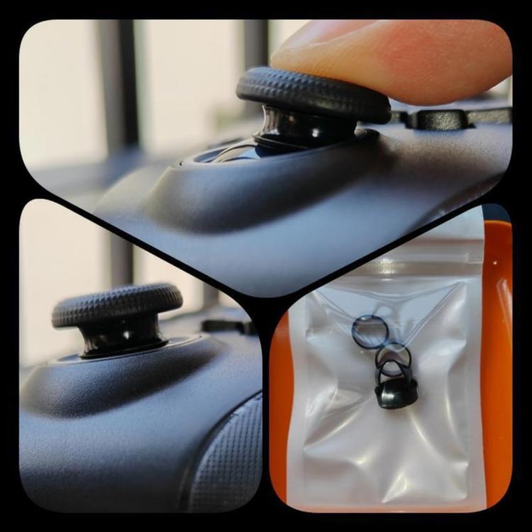 Black joystick silicone cap protector installed on a controller, with accessory pouch