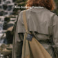 Black PINCARD Ultra Mini tag clipped to a backpack strap