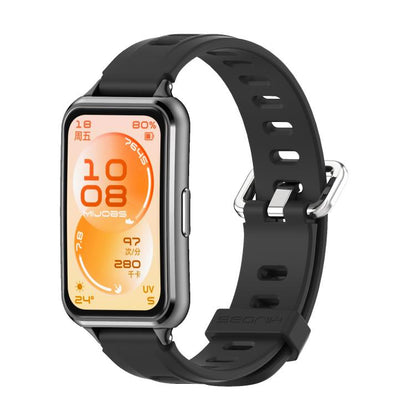 Black perforated TPU watch band fitted to a dark watch case.