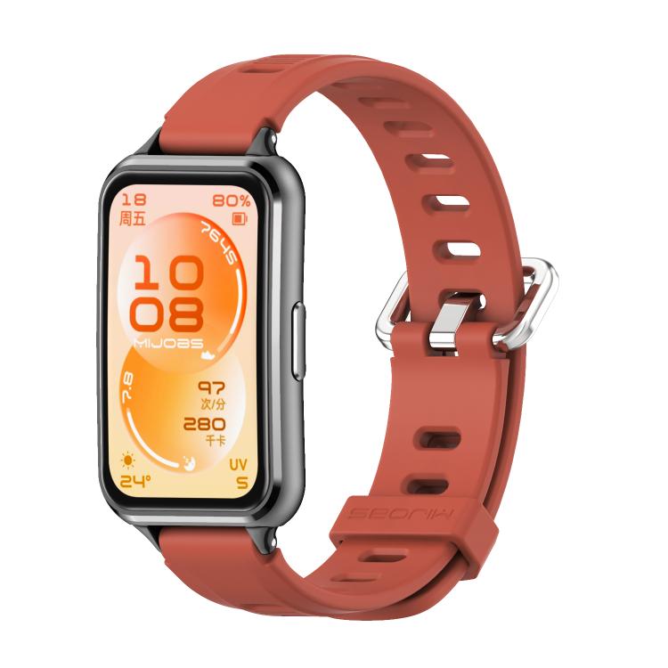 Orange perforated TPU watch band with a dark watch case.