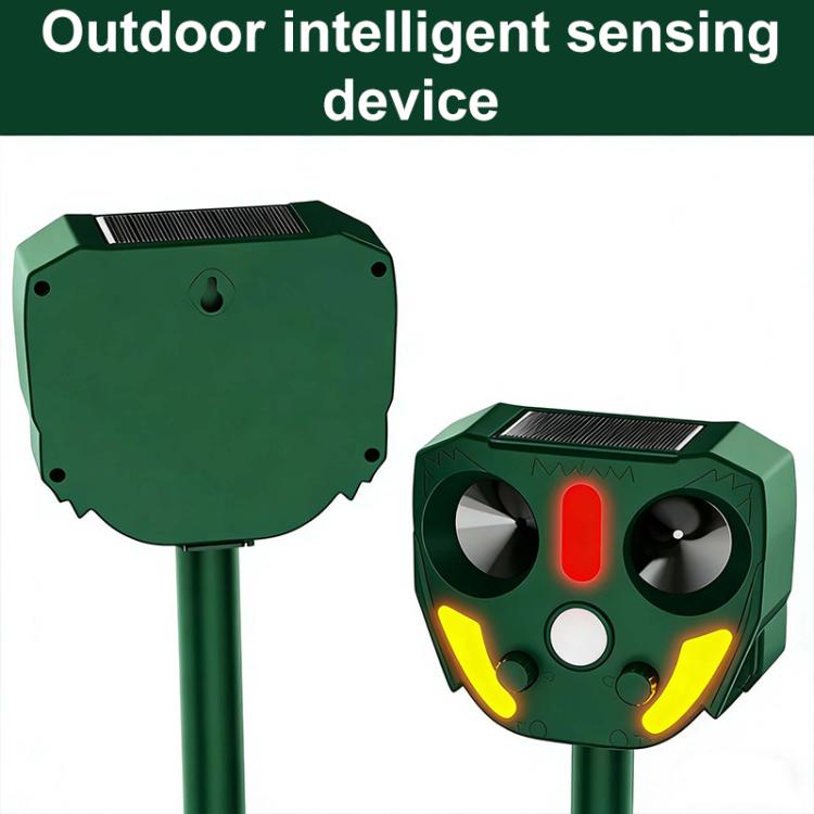 Dark green solar animal repellent with red center indicator and yellow side glow, dual speaker vents