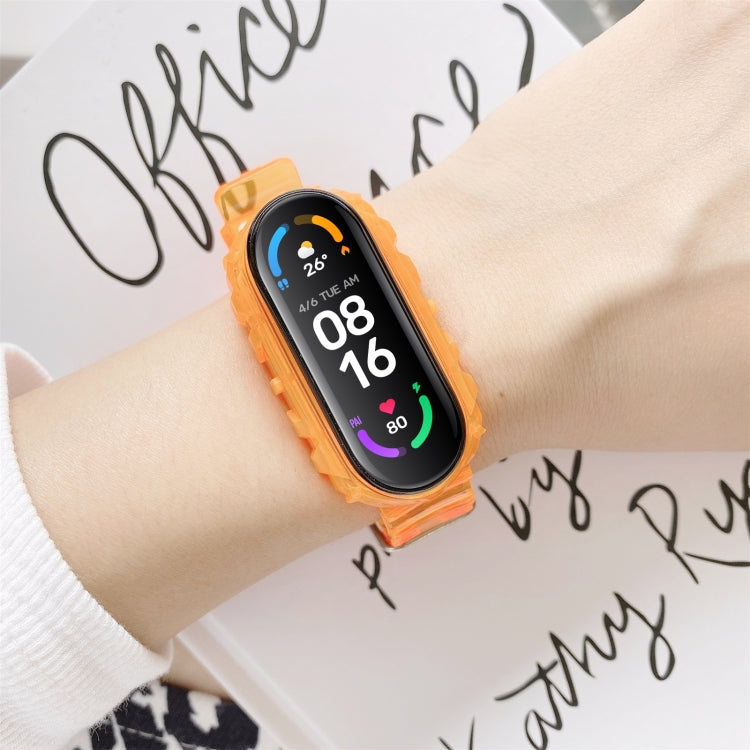 Orange silicone watch strap with smartwatch display on wrist
