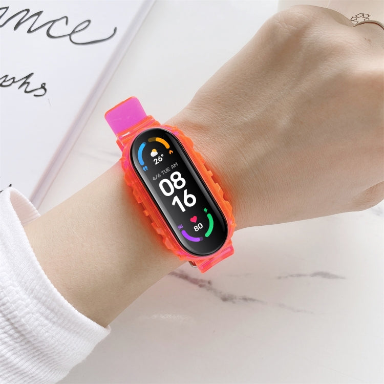Pink-orange silicone replacement watch strap with smartwatch display on wrist