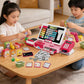 Pink shopping cash register playset with shopping accessories on tabletop