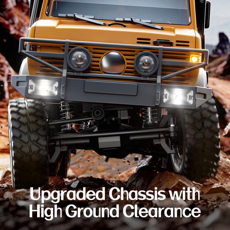 Orange RC off-road truck front with lights and high-ground-clearance chassis.