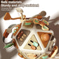 Busy board cube toy with brown and teal buttons, knobs, and spinning wheel