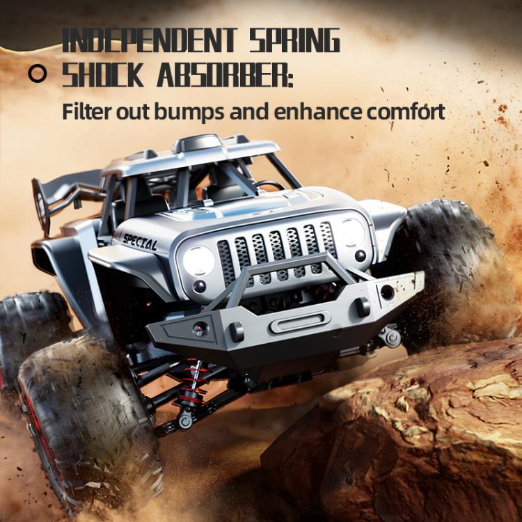 Silver off-road remote control truck with front bumper and spring suspension over rocks