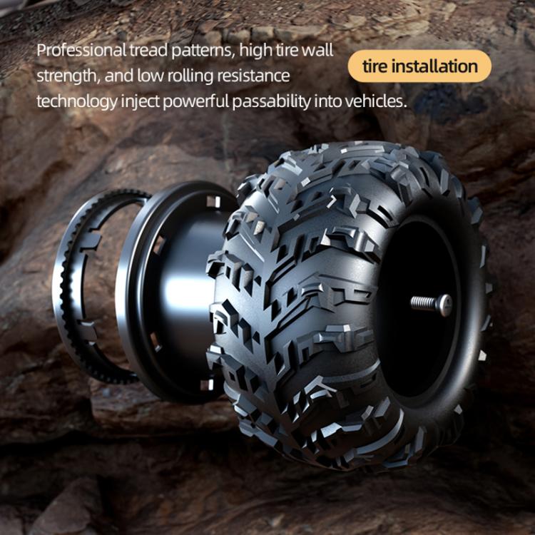 Close-up of off-road remote control truck tire with deep tread on rocky surface