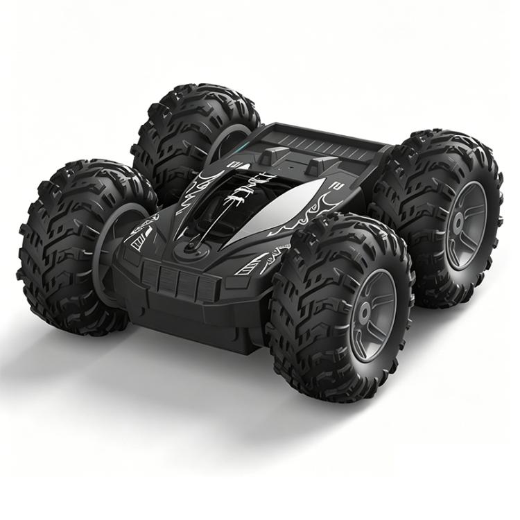 Black RC stunt car with large off-road tires, rugged body, and gray accents on hood.