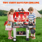 Red and white electric grill toy with black cooking plate and accessory side bin