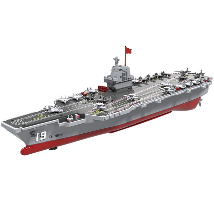 Remote-controlled aircraft carrier toy with gray deck, red hull, and red mast flag.