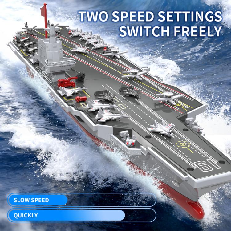 Remote-controlled aircraft carrier toy top deck with runway markings and red mast flag.