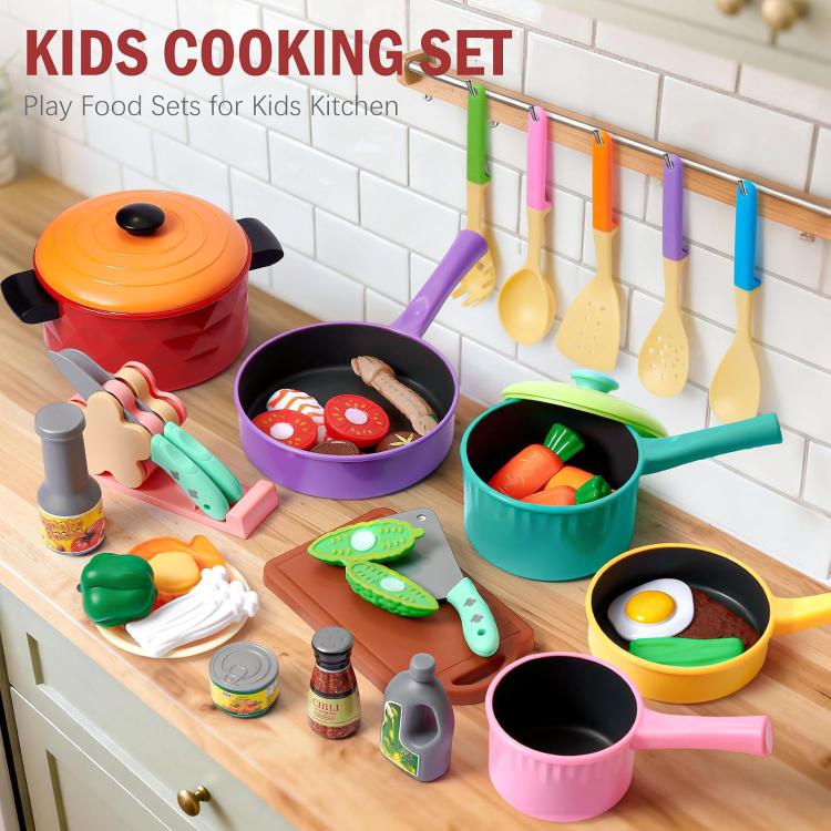 Children's cooking play set with colored pots, pans, and pretend food utensils