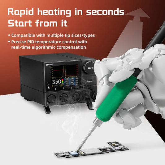 Black soldering station with green soldering iron tip held above PCB